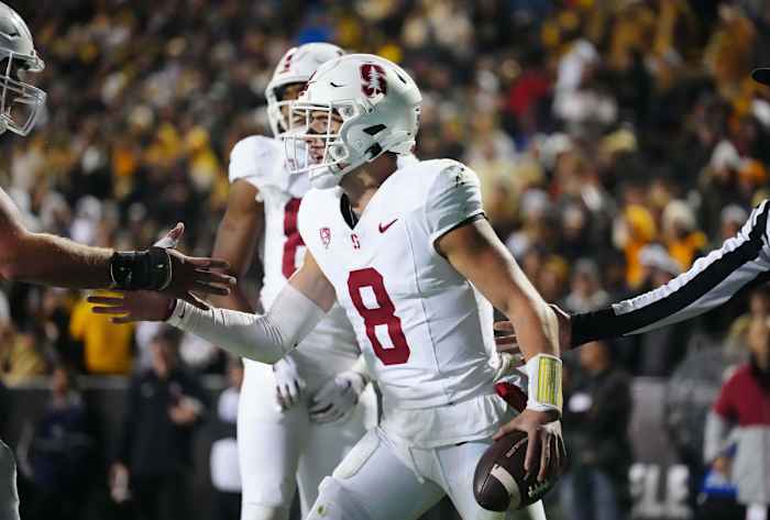 Oct 13, 2023; Boulder, Colorado, USA; Stanford Cardinal quarterback Justin Lamson (8) celebrates his 1 yard touchdown carry in the third quarter against the Colorado Buffaloes at Folsom Field. Mandatory Credit: Ron Chenoy-USA TODAY Sports
